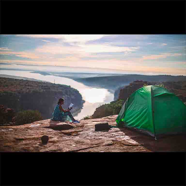What else you do need when you have a book, a view, and all the peace. Forward this to someone who needs a day or two of camping.