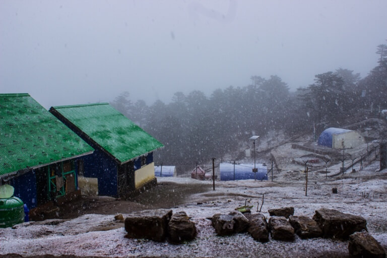 A fresh coat of snow as the sun dips down low. Share this with a friend who loves snowfall.