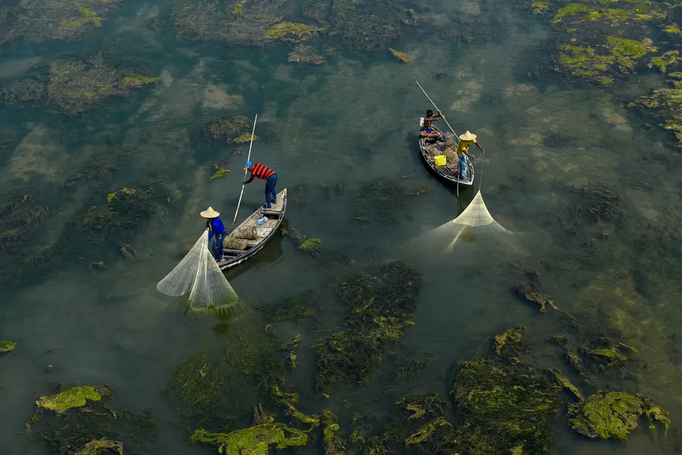 Photo of A Photographer's Delight: Fishermen At Work, Near Mossy River by Shibasish Saha