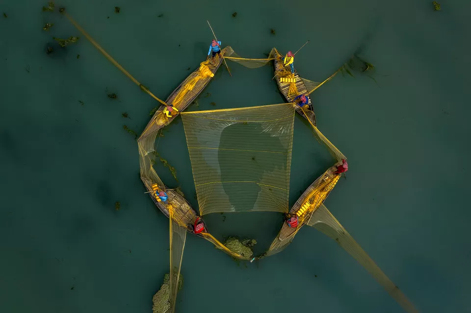Photo of A Photographer's Delight: Fishermen At Work, Near Mossy River by Shibasish Saha